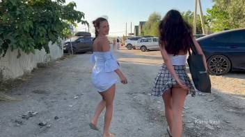 Two girls walk in public without panties and show pussies
